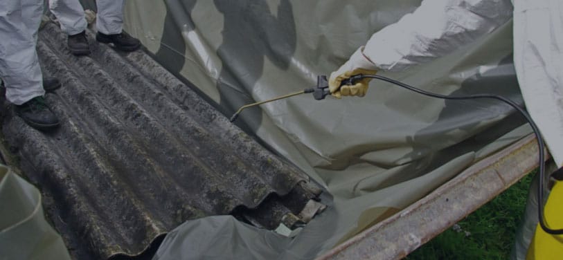 Removing asbestos during abatement process
